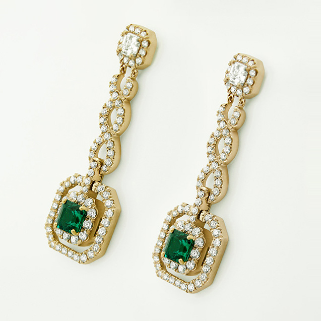 Pavé-set diamond and Colombian emerald earrings